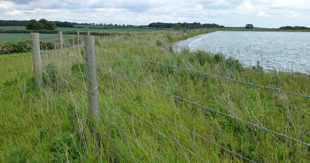 Irrigation reservoir beside arable fields north of Castle Acre, Norfolk