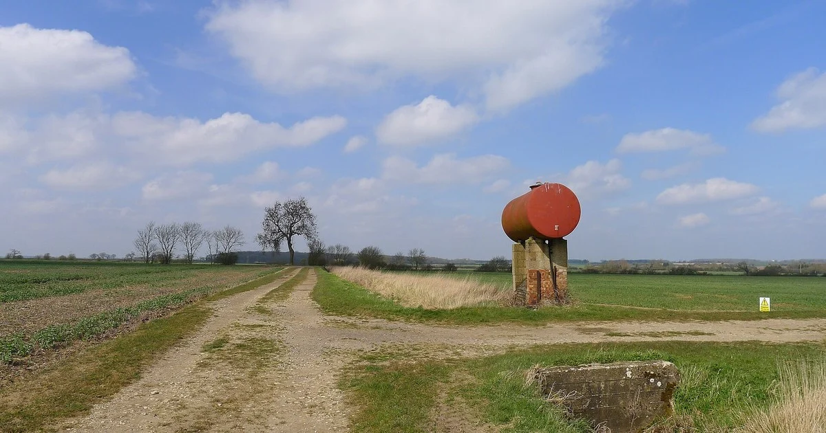 Fuel tank by farm tracks