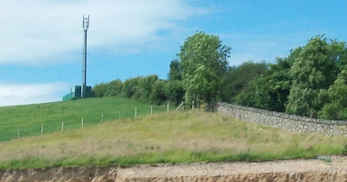 Telecommunications mast above the A24